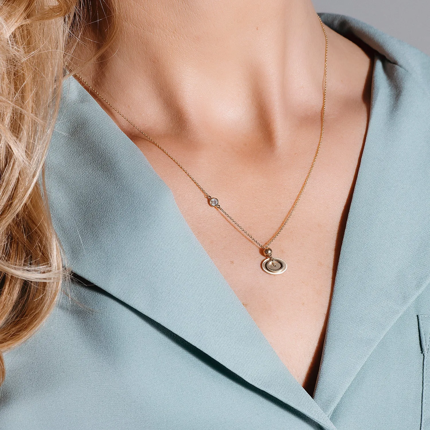0.10 CTW DEW Moissanite Oval Disc Pendant in 14K Yellow Gold