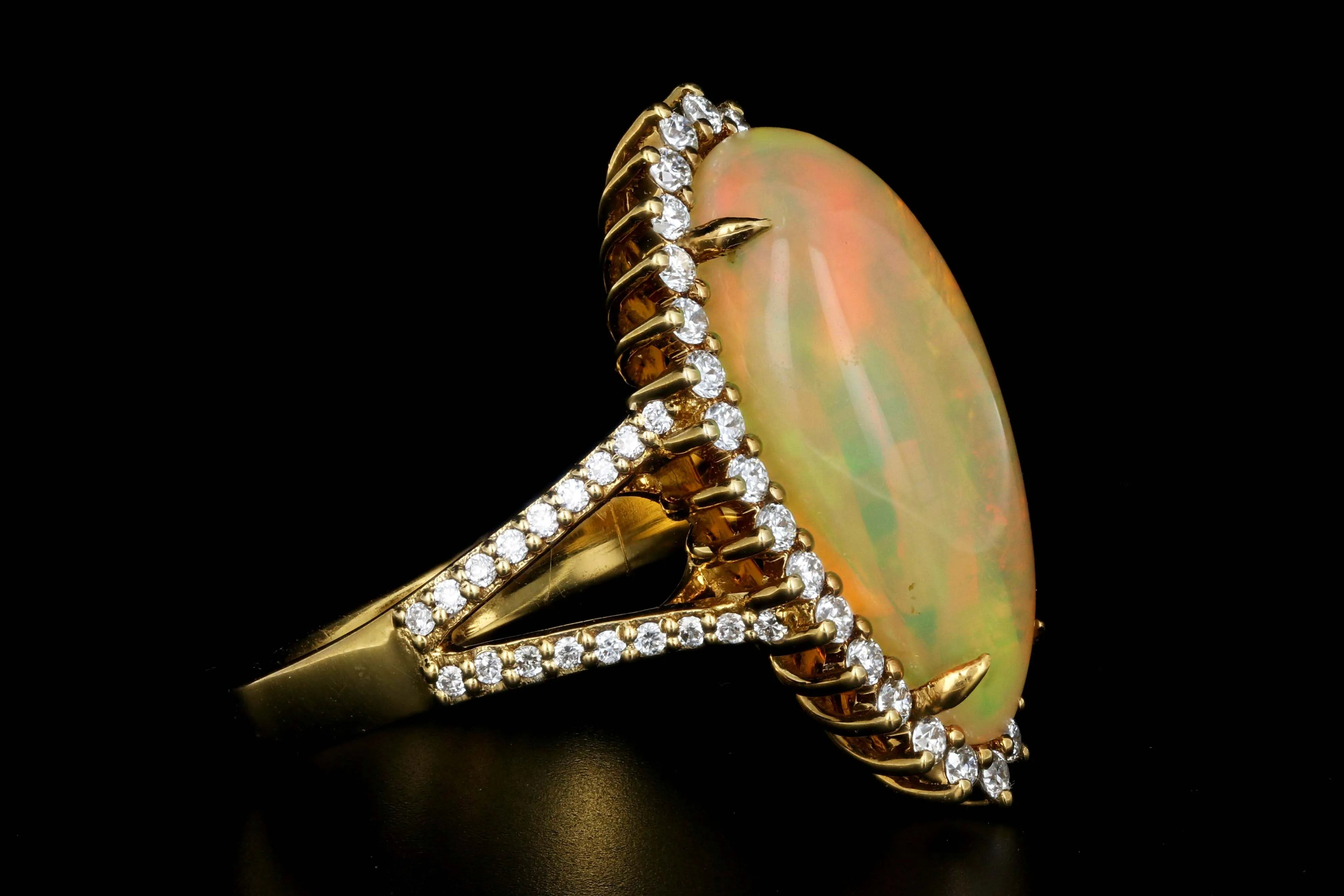 14K Yellow Gold 8.5 CT Ethiopian Opal with .75CTW Diamond Halo Ring
