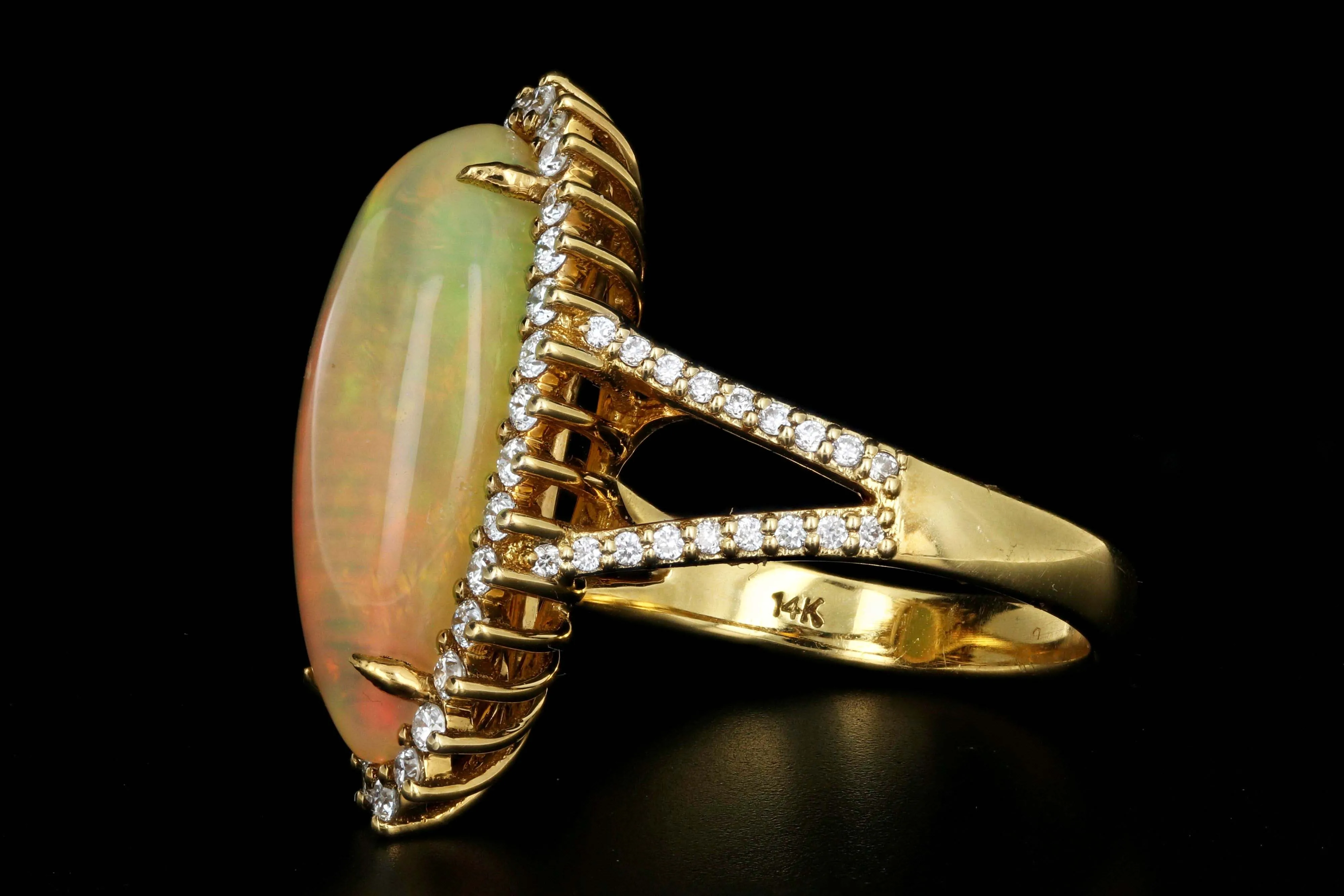 14K Yellow Gold 8.5 CT Ethiopian Opal with .75CTW Diamond Halo Ring