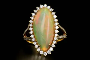 14K Yellow Gold 8.5 CT Ethiopian Opal with .75CTW Diamond Halo Ring