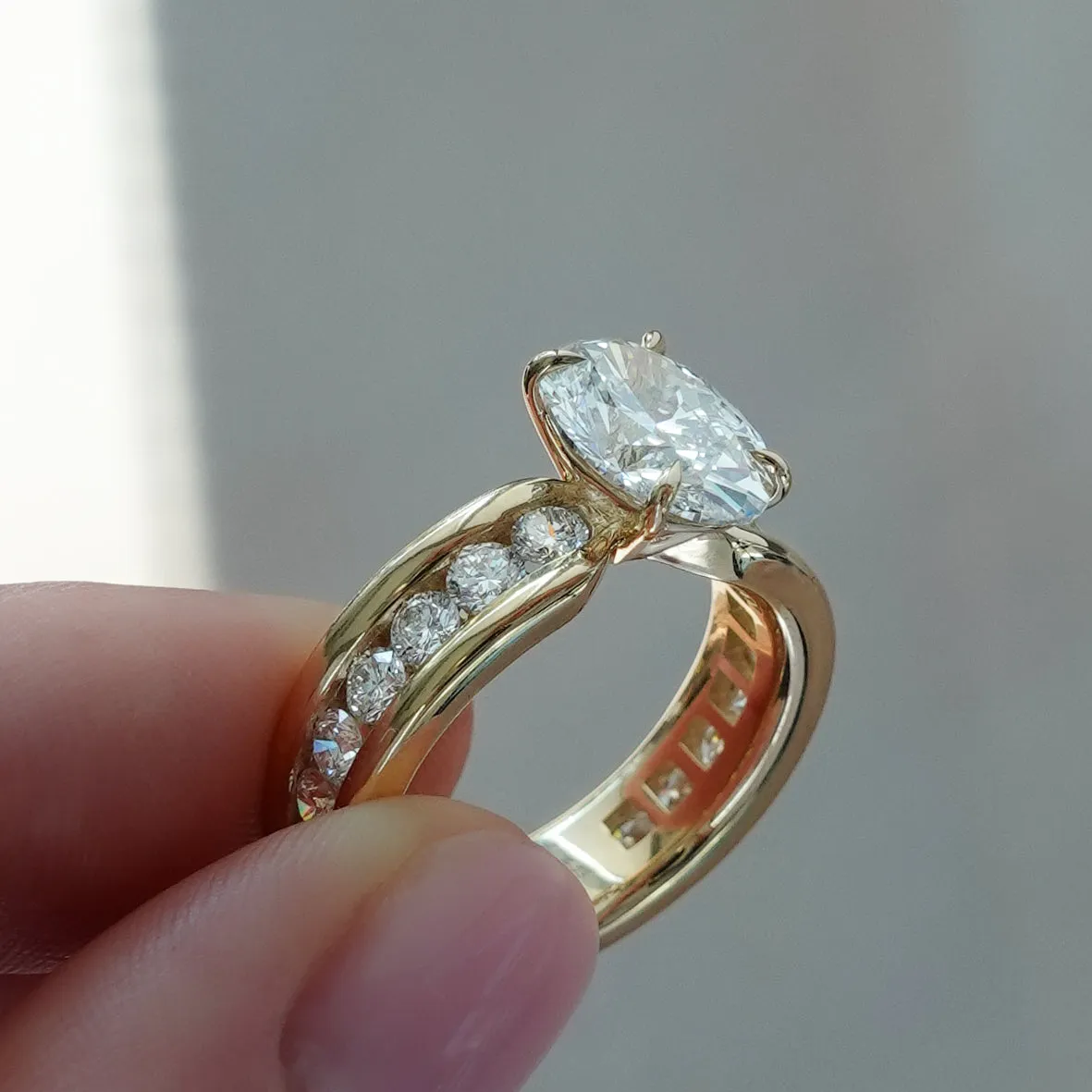Chunky Channel Set Engagement Ring with Oval Cut Diamond