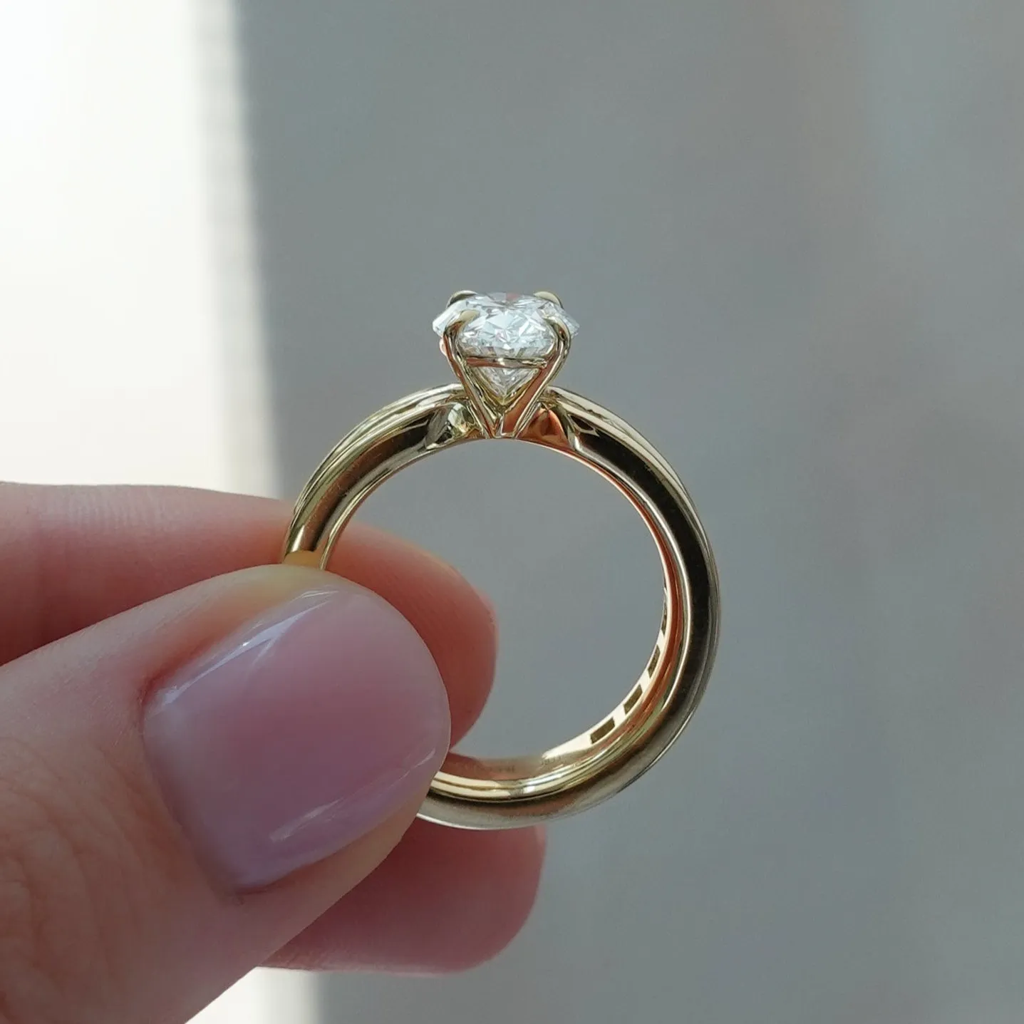 Chunky Channel Set Engagement Ring with Oval Cut Diamond