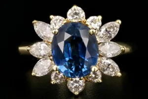 Modern 14K Yellow Gold GIA Certified 2.5 Carat Natural Sapphire and Diamond Halo Ring