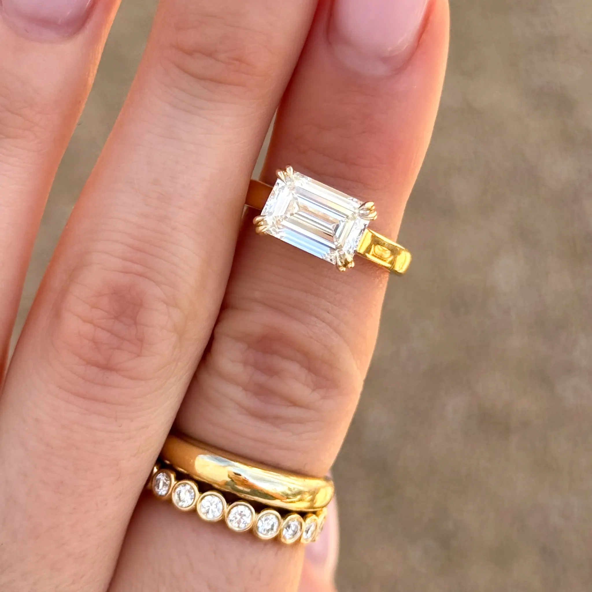 Signature Cathedral Solitaire Engagement Ring With Emerald Cut Diamond (East West)