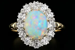 Victorian Style 18K Yellow Gold and Platinum 1.68 Carat Oval Cut Opal and Diamond Ring